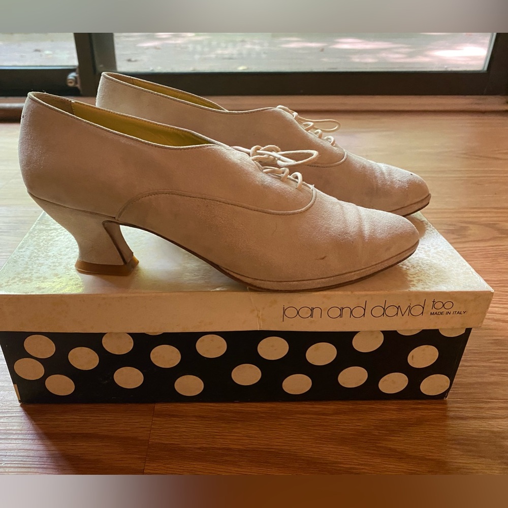 Vintage off-white suede shoes.